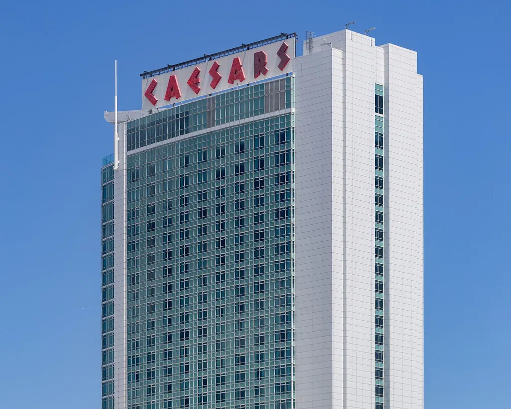 A hotel tower at Caesars Windsor, with the red CAESARS letters on its rooftop sign — Caesars Windsor