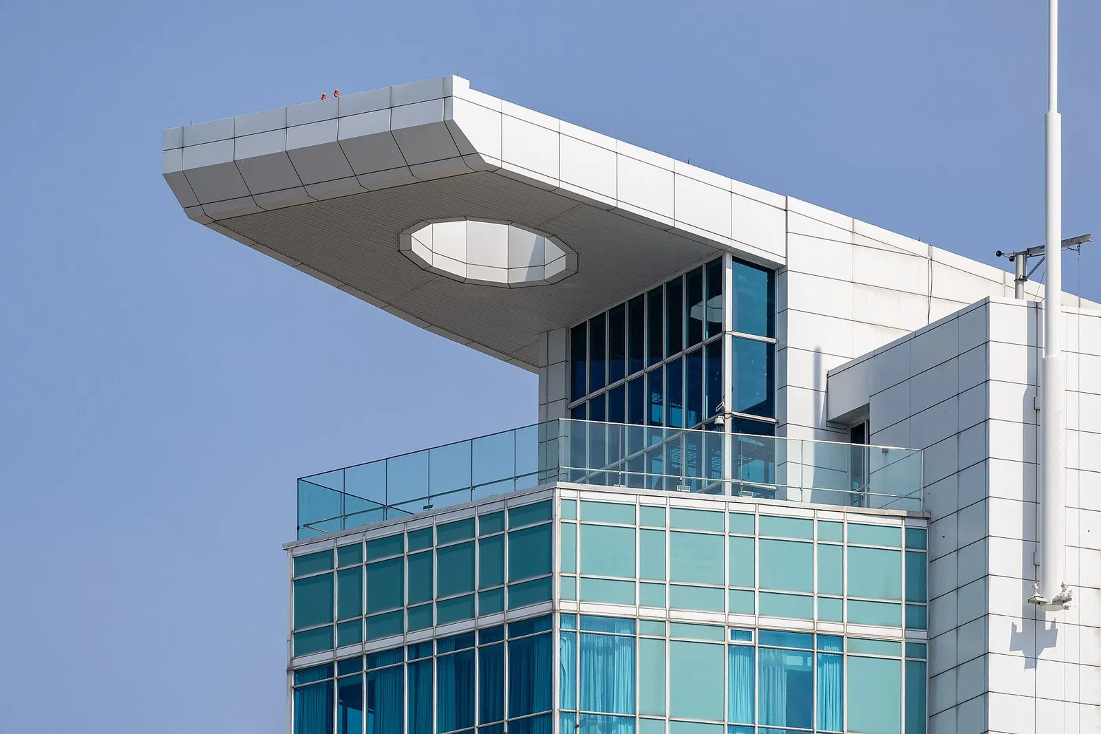 Cantilevered roof slab with an oval opening above the top-floor terrace of the Augustus Tower at Caesars Windsor — Caesars Windsor