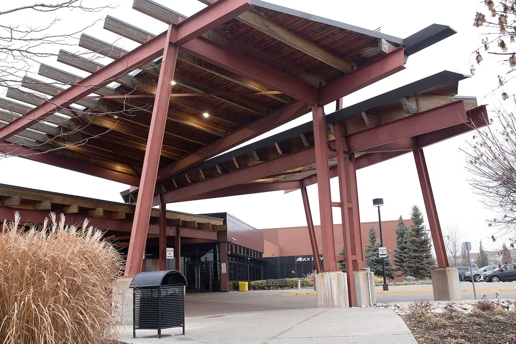 Steel and timber beams of the entrance canopy at Casino Ajax — Casino Ajax