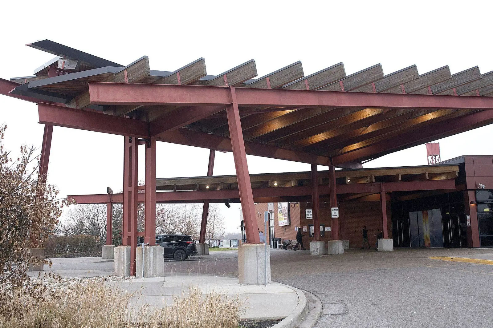 The steel-and-timber entrance canopy at Casino Ajax, Ontario — Casino Ajax