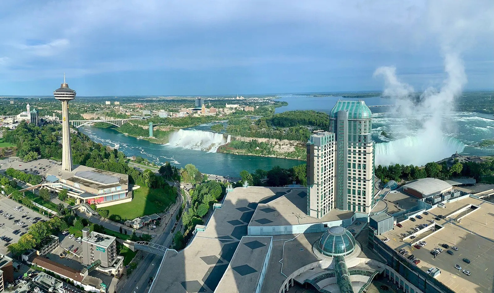Fallsview Casino Resort overlooking the Horseshoe Falls, with the Skylon Tower, the American Falls and the Rainbow Bridge to the left — Fallsview Casino Resort