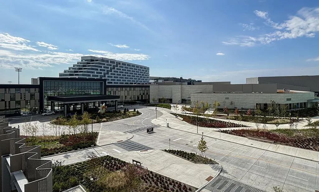 Great Canadian Casino Resort Toronto: the stepped hotel tower and the glass entrance pavilion under its canopy, with the lower casino buildings and the theatre block beyond the landscaped drop-off lanes — Great Canadian Casino Resort Toronto
