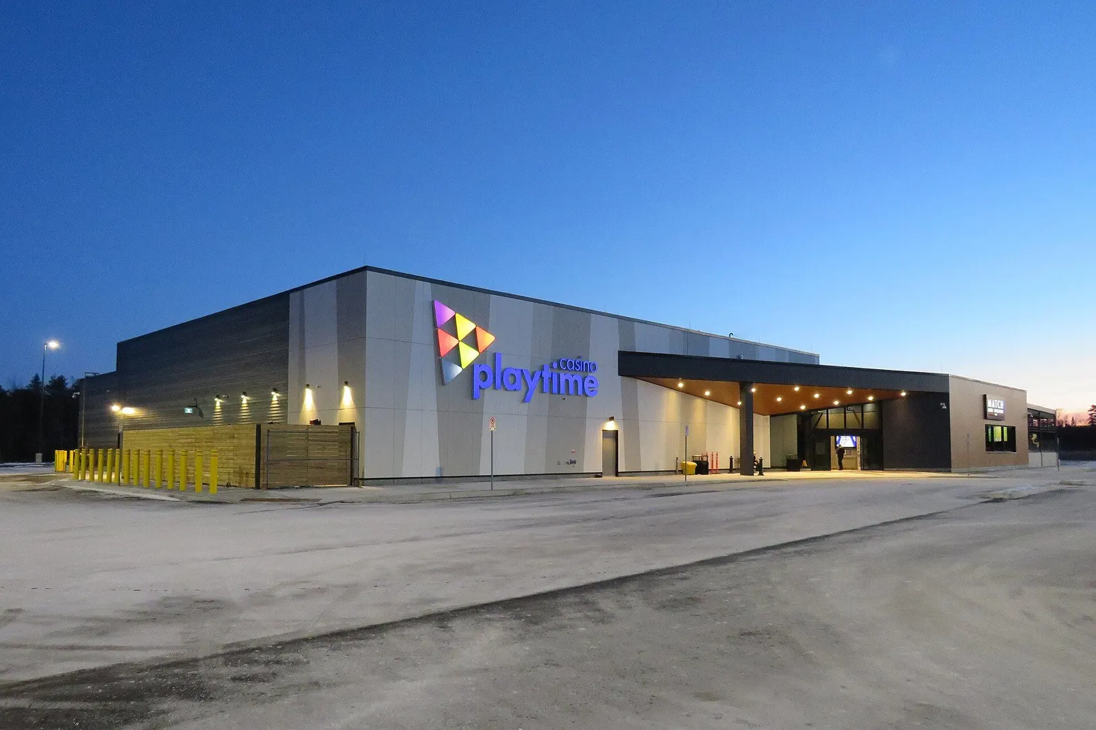 Playtime Casino Wasaga Beach at dusk, with the illuminated sign and entrance canopy — Playtime Casino Wasaga Beach